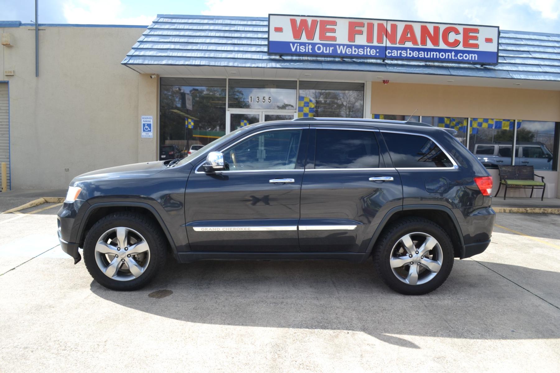 2013 Mineral Gray Metallic /Black Leather Interior Jeep Grand Cherokee Overland 4WD (1C4RJFCT1DC) with an 5.7L V8 OHV 16V engine, 5-Speed Automatic transmission, located at 1355 North 11th Street, Beaumont, 77702, (409) 832-0006, 30.094290, -94.130096 - Photo #1